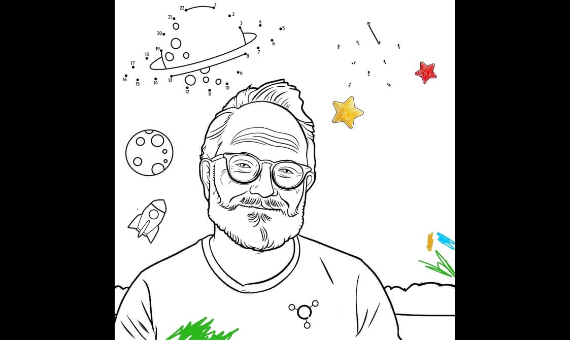 A black and white illustration of Robin Ince. He has a beard and is wearing glasses. The illustration is in the style of a colouring book. There are planets and stars in the background.